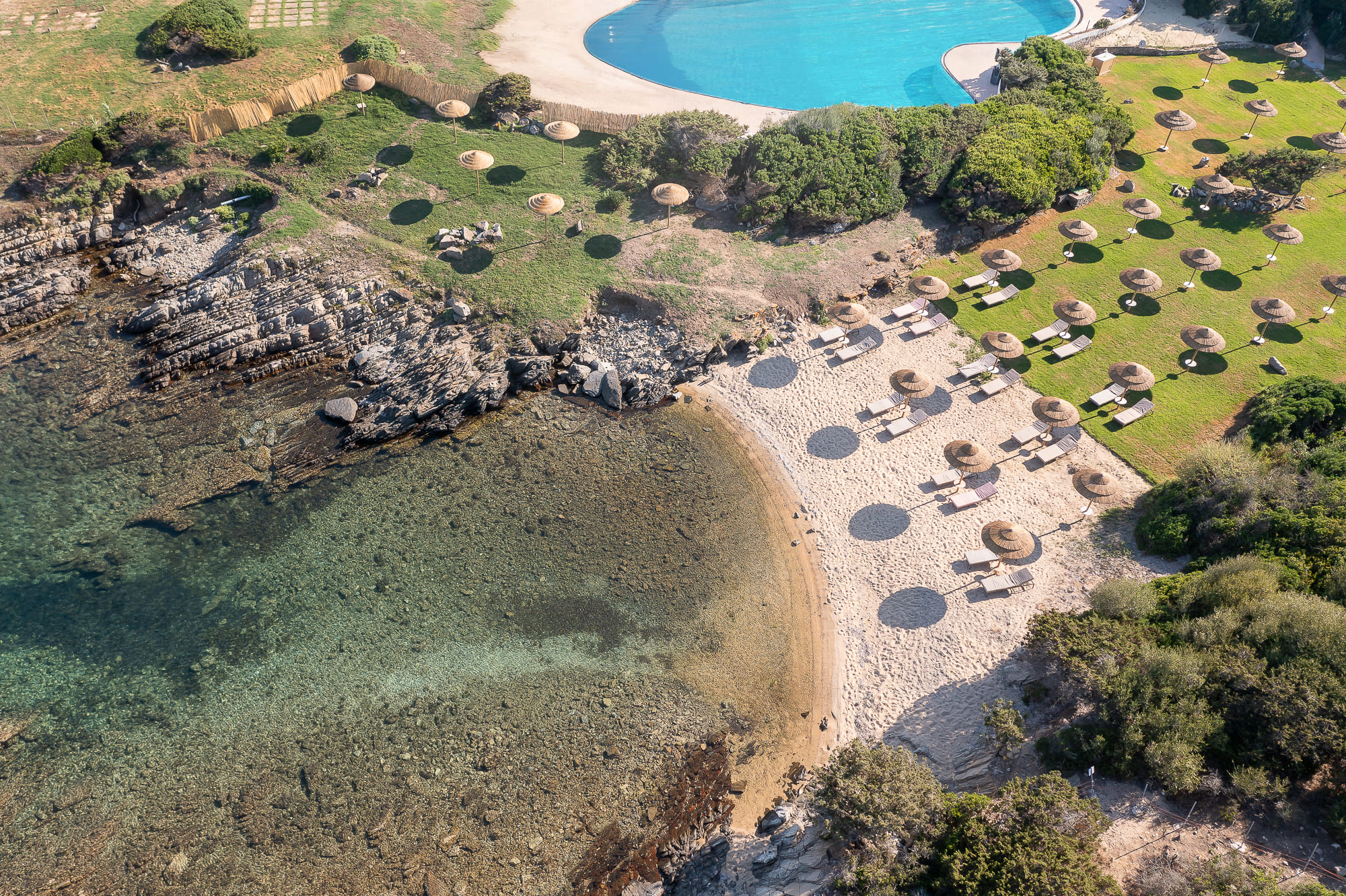 Saltwater pool overlooking the sea at Cala Lupo Resort Stintino